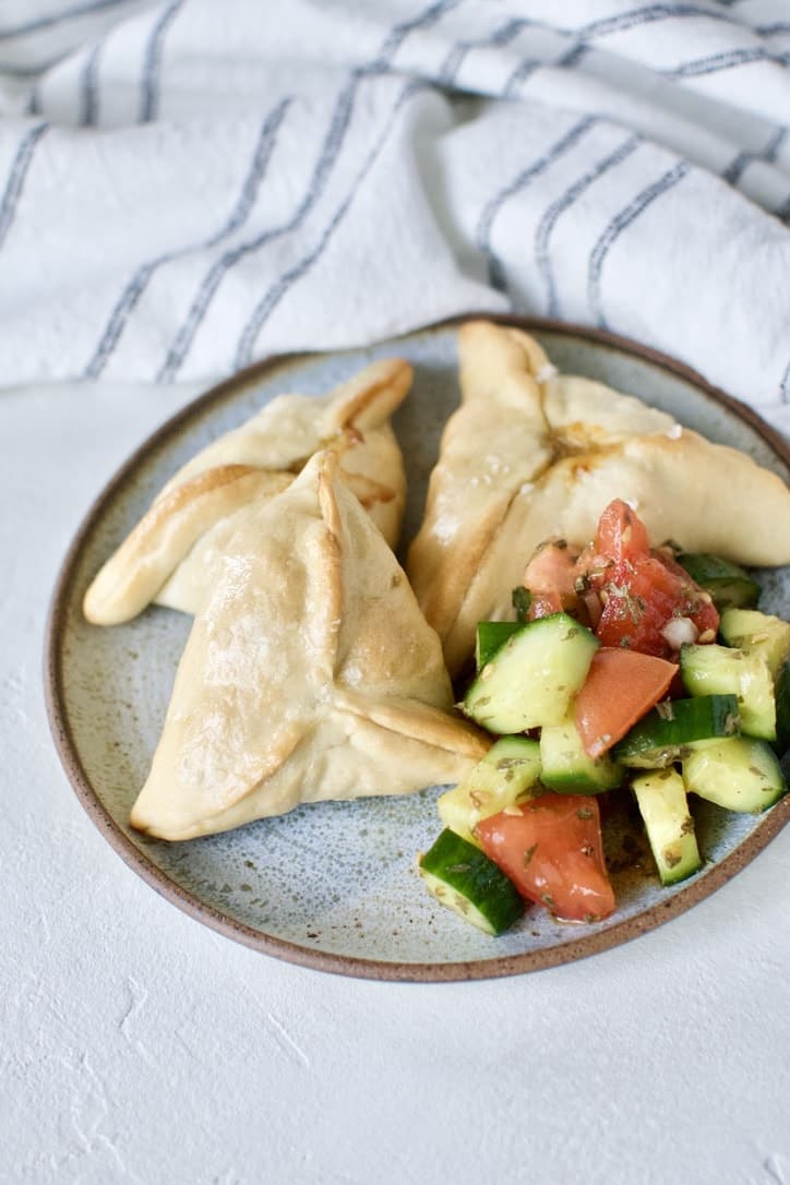 Joanna Gaines recipe for Jo's Fatayar with Lebanese Salad served on a plate with the salad served on the side.