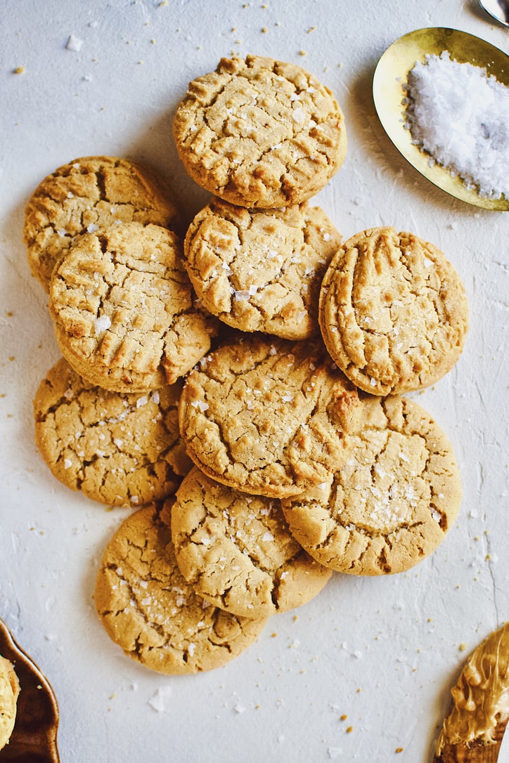 Crunchy Peanut Butter Cookies laid in a pile.