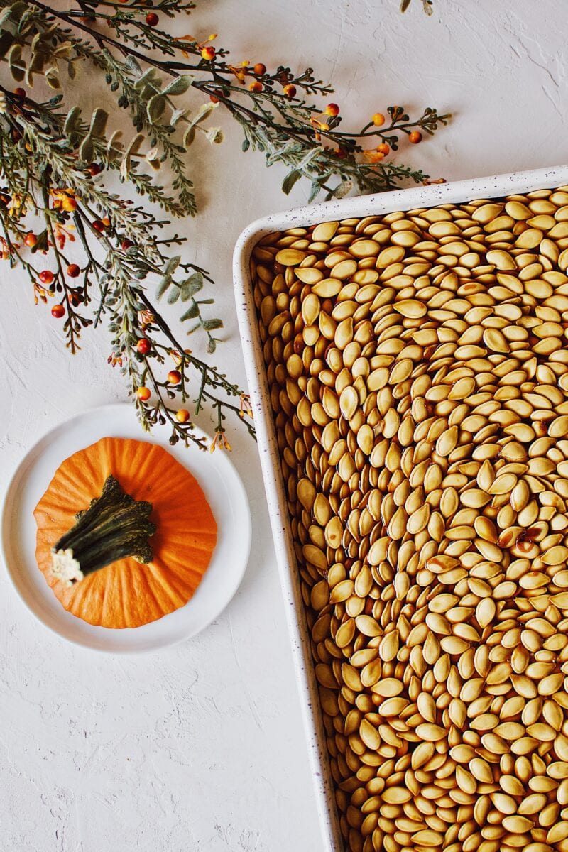 Soy Sauce Pumpkin Seeds soaked in soy sauce and on a sheet pan ready to eat.