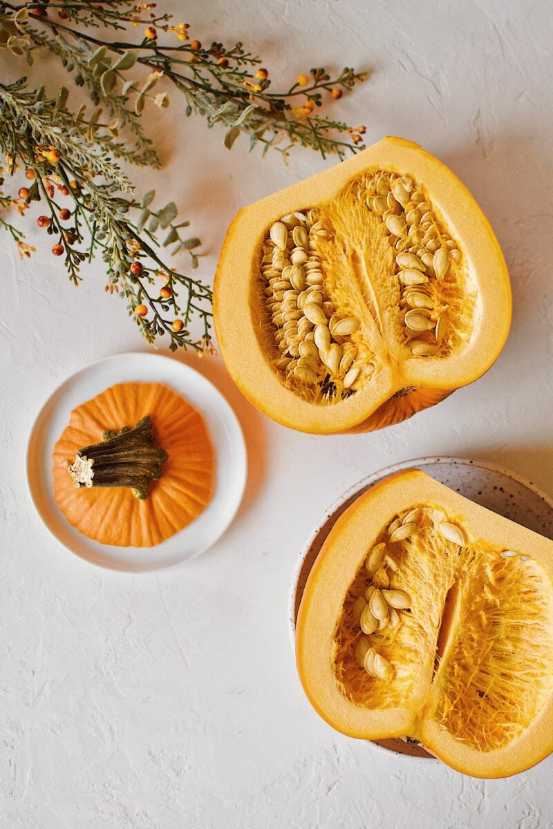 a sugar pie pumpkin halved.