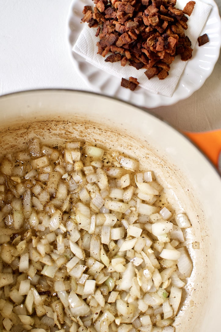 creating flavor in the bottom of the soup pot, cooking onions in the rendered bacon fat.