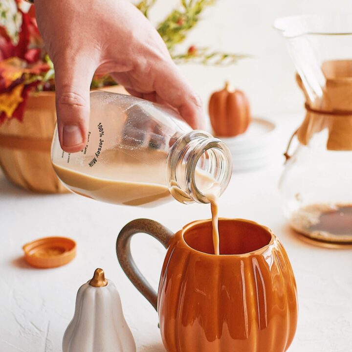 Pumpkin Spice Coffee Creamer being poured into a cup of coffee