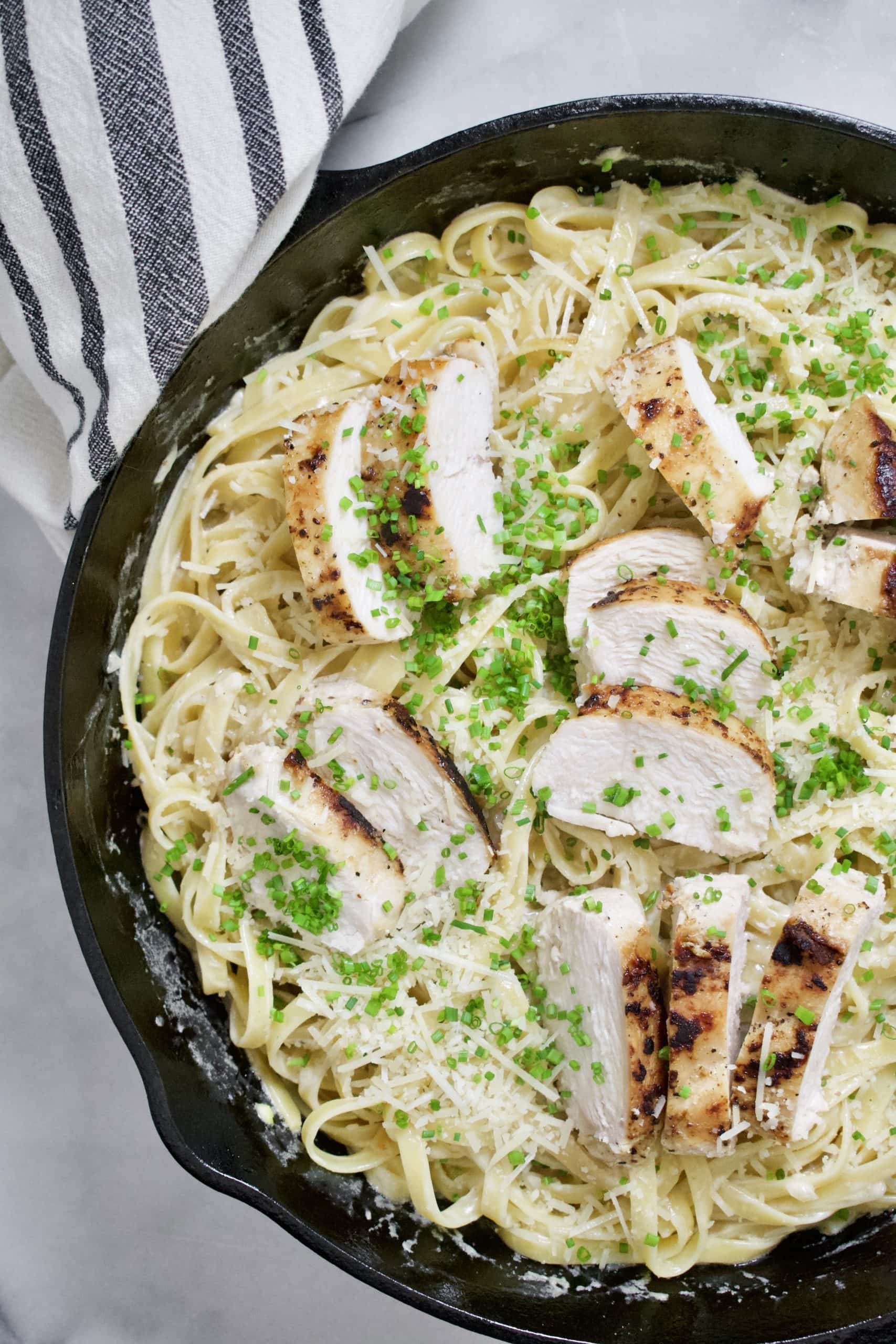 Restaurant Style Alfredo sauce on fettuccine pasta and topped with grilled chicken breast.