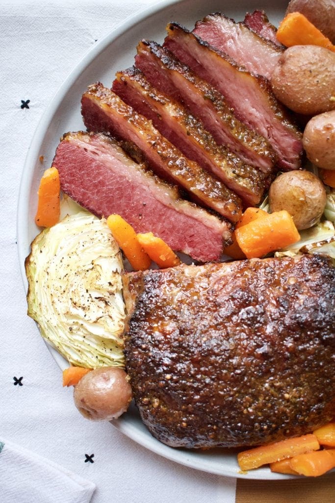 Sliced Corned Beef and Cabbage on a platter.