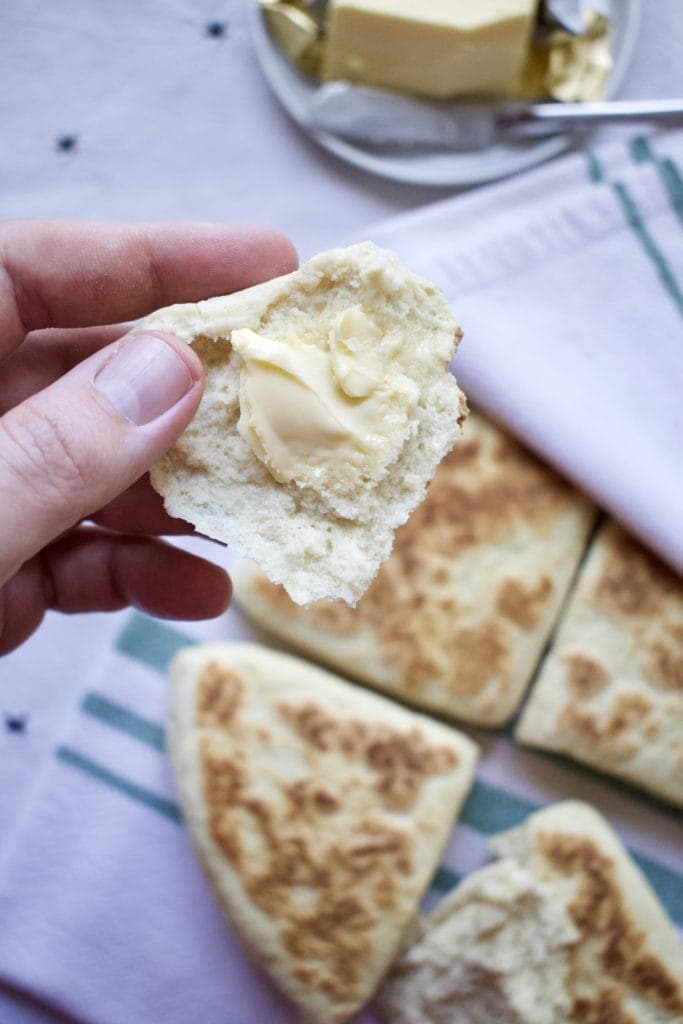 Classic Irish Soda Bread with Irish butter on a piece.