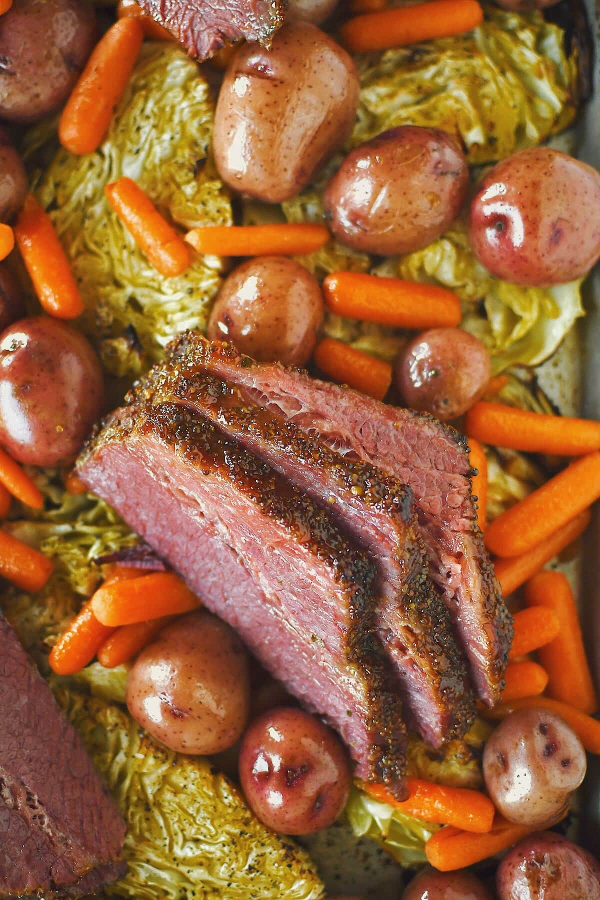 Corned Beef and Cabbage served on a platter with potatoes and carrots ready for the buffet.