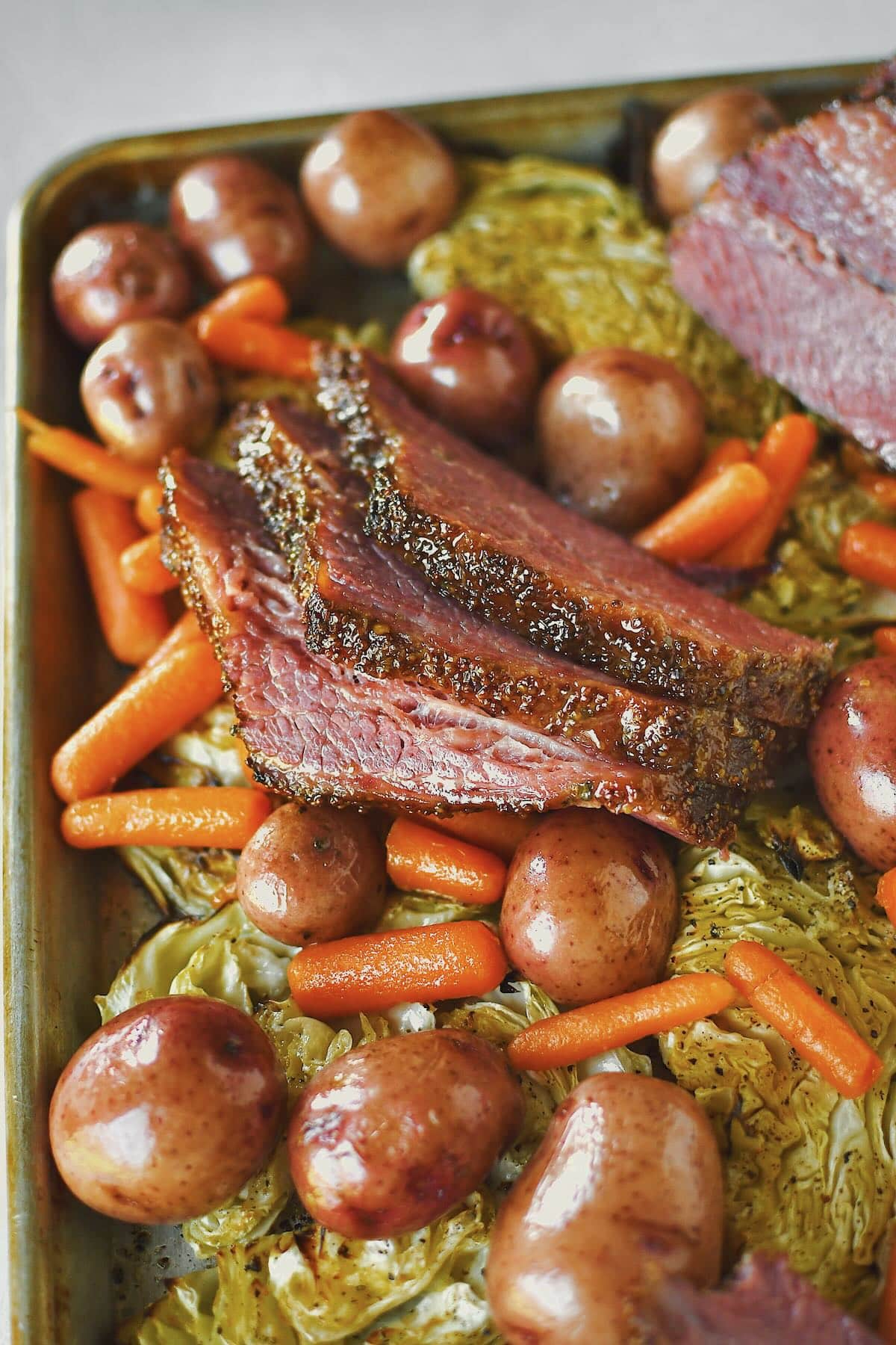 Corned Beef and Cabbage served on a platter with potatoes and carrots ready for the buffet.