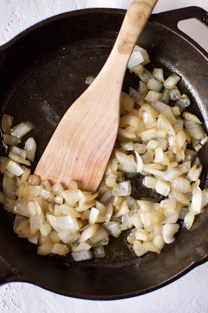 Sauteed onions and butter in a cast-iron pan.