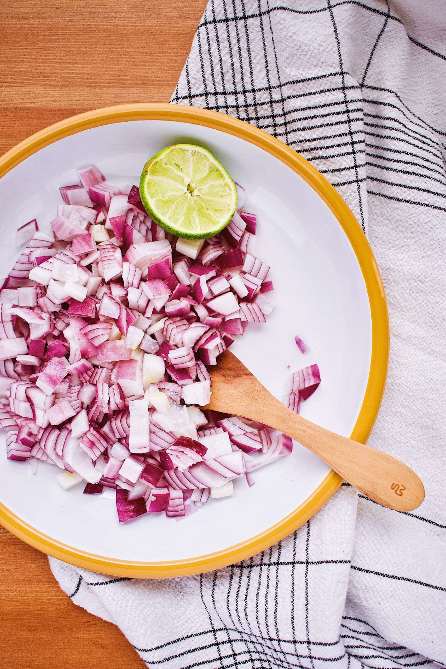 Diced red onion marinated in lime juice