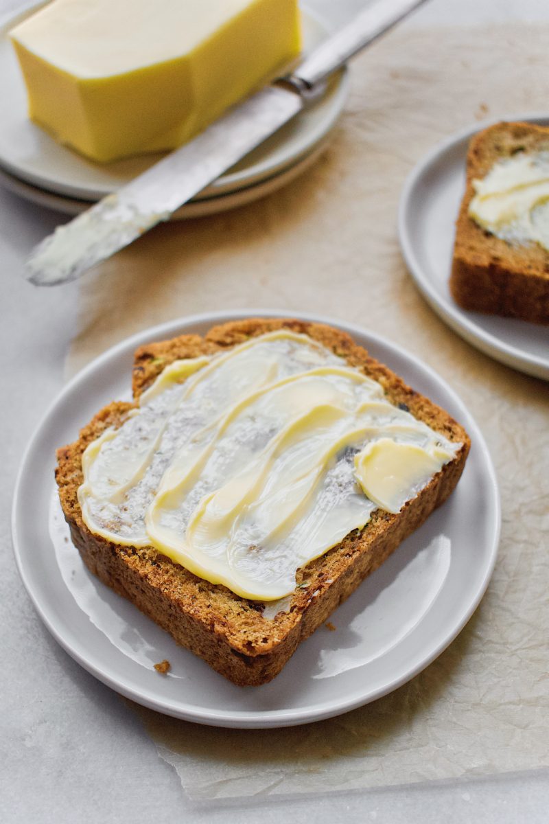 Joanna Gaines Zucchini Bread slice, topped with Irish butter