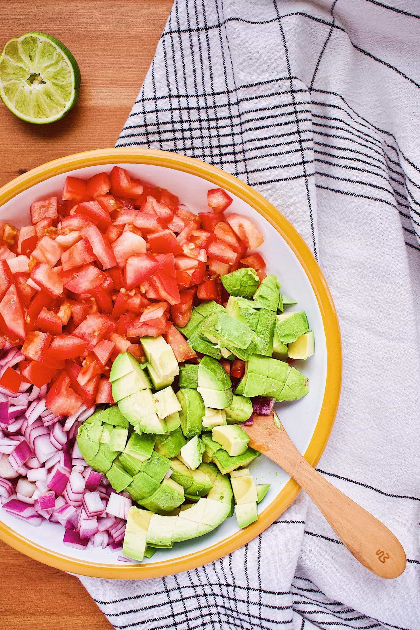 Avocado Salsa ingredients in a bowl ready to be mixed gently