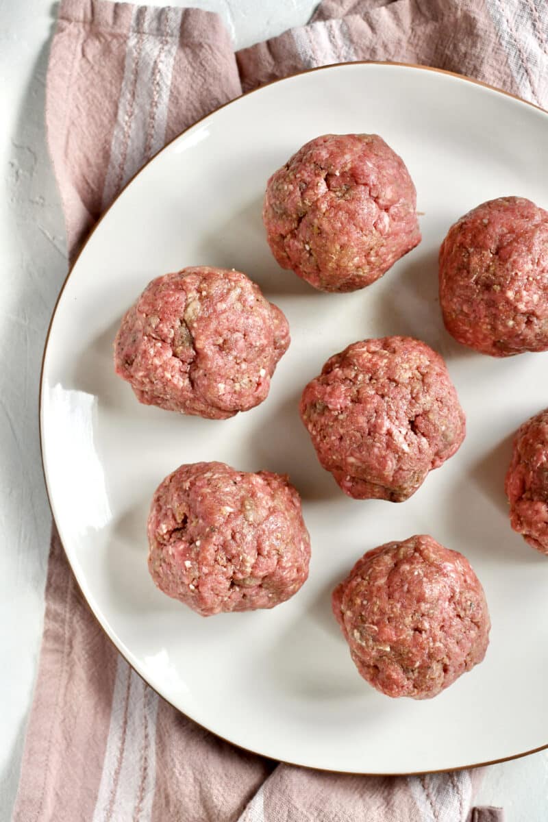 Portioned out burgers in 6 ounce balls.