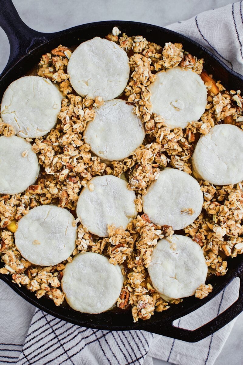 Skillet Peach Cobbler with Homemade Biscuits and Crumble on top