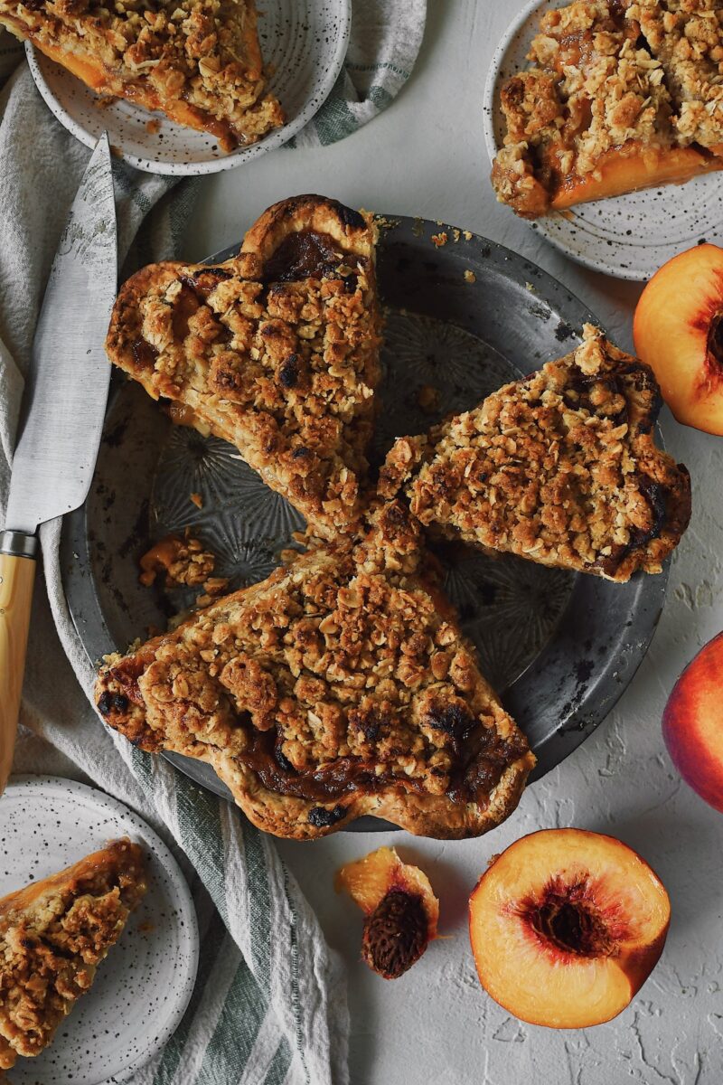 Looking closely into the pie tin at the spiced peach pie.