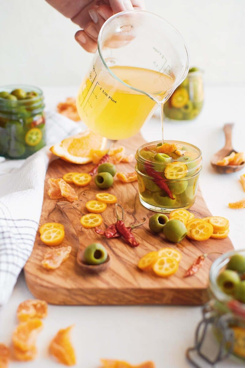 Pouring the brine on to the olives