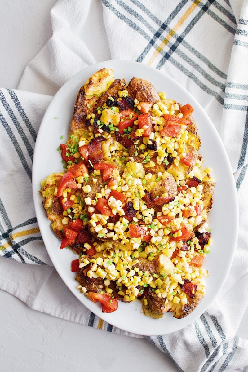 Smashed Potatoes with Bacon, Corn, and Tomato Salad