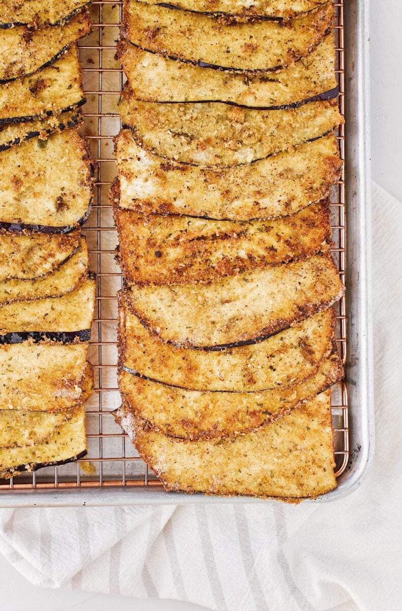 fried eggplant slices ready to be rolled