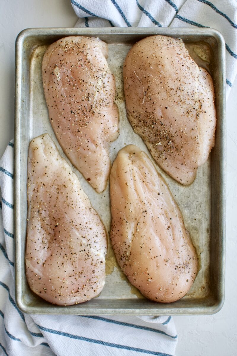 Seasoned chicken breasts waiting to be cooked