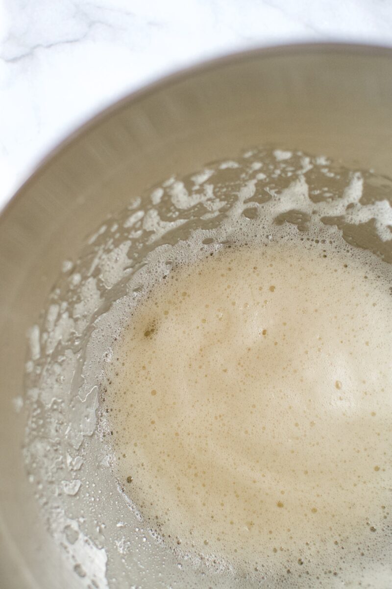 whipped egg whites, water, and vanilla in a bowl