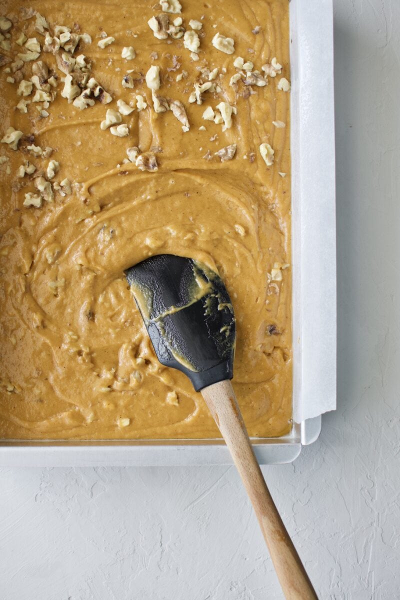 Mixing the walnuts into the cake batter