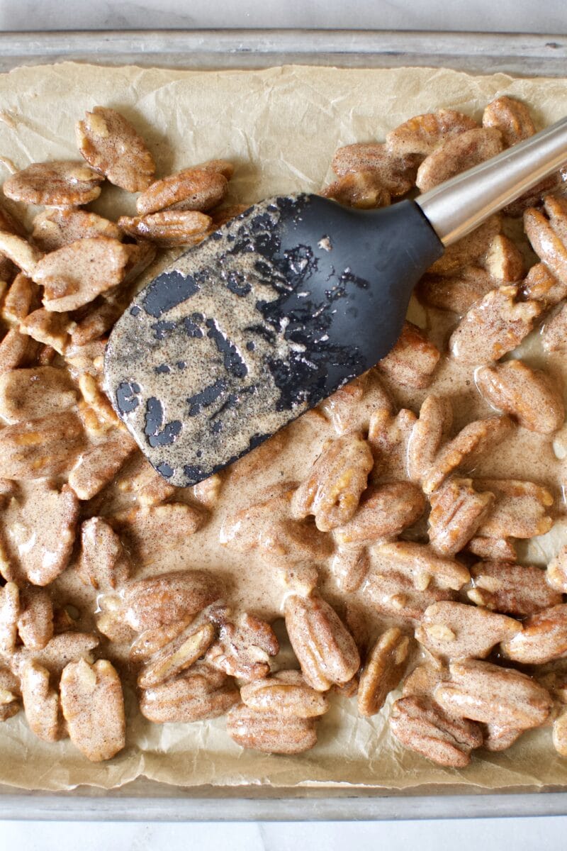 Seasoned pecan halves ready to bake