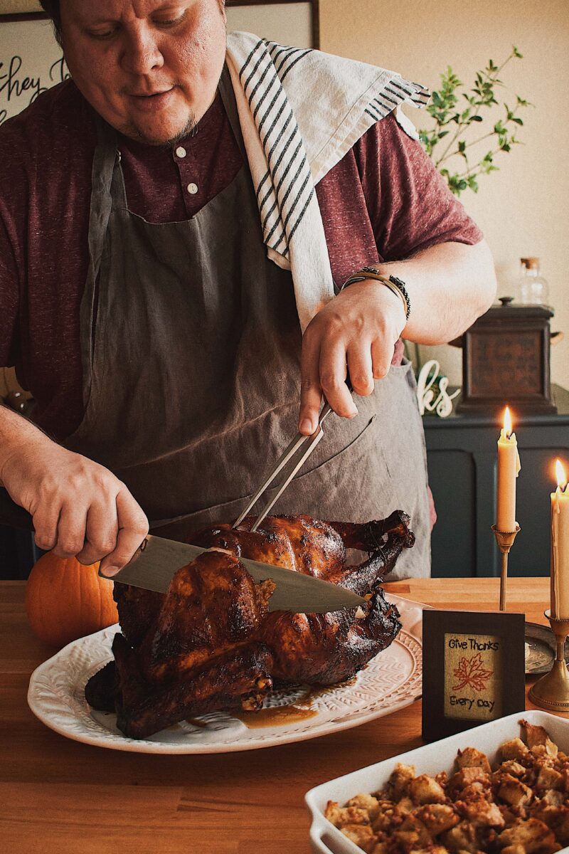 Kendell carving the roasted Soy-Maple Glazed Roast Turkey.