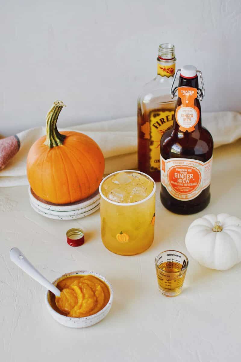 spiked sparkling pumpkin juice with pumpkin spice ginger beer and cinnamon whisky.