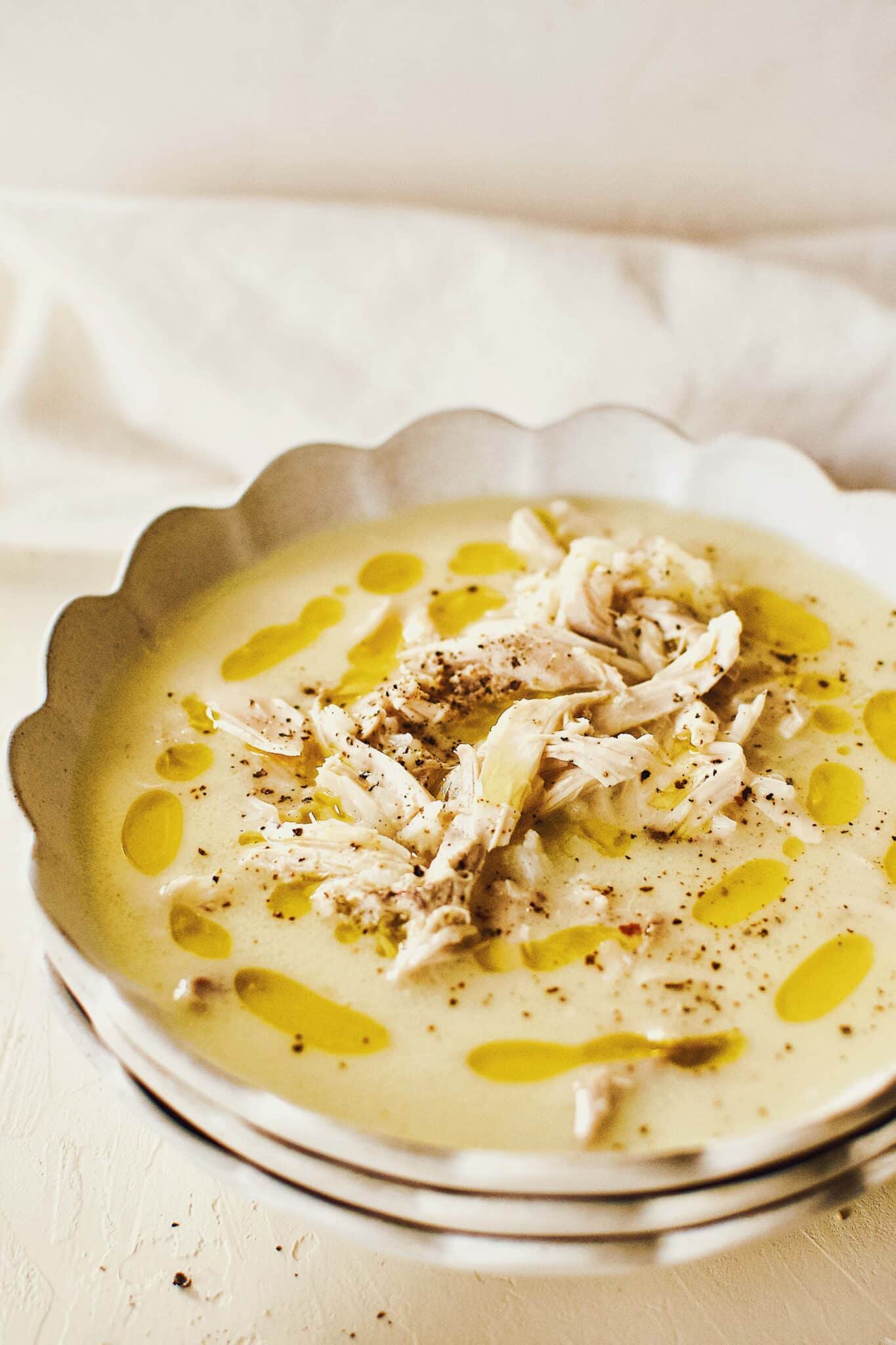 Greek Avgolemono Lemon Rice Soup in a white bowl ready to eat.