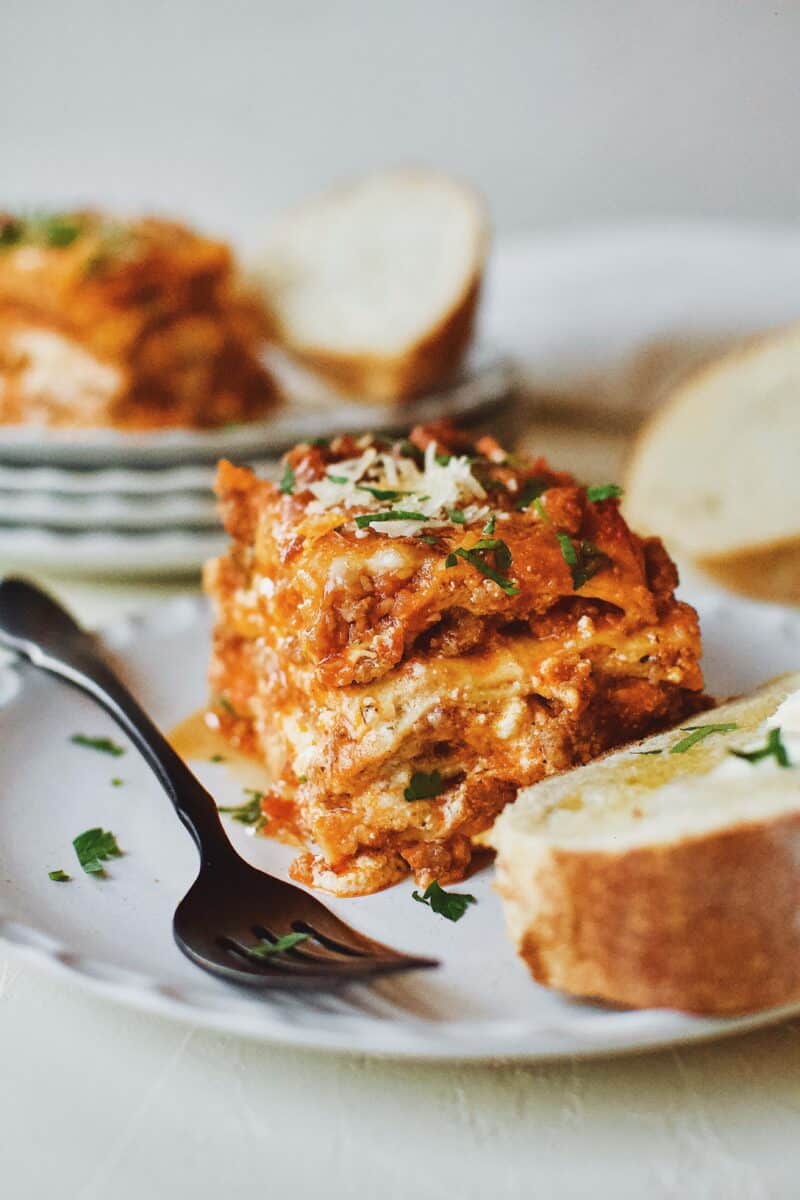 Homemade Lasagna served with toasted bread and butter.