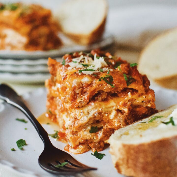 Homemade Lasagna served with toasted bread and butter.