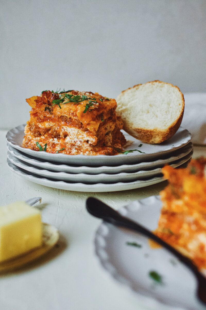 Homemade Lasagna served with toasted bread and butter.