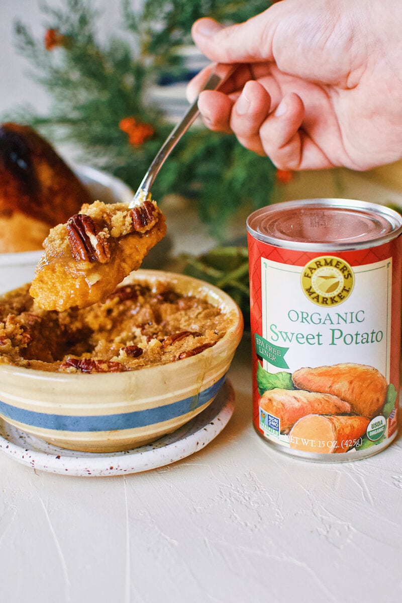 Great Aunt Sally's Sweet Potato Soufflé right out of the oven with a can of Farmers Market Foods Sweet Potato puree next to it.