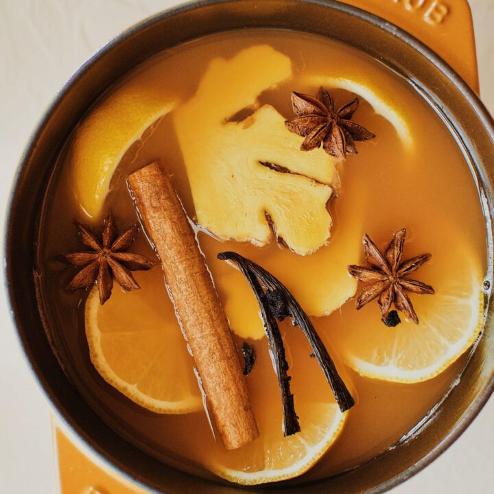 Wassail steeping in a pot.