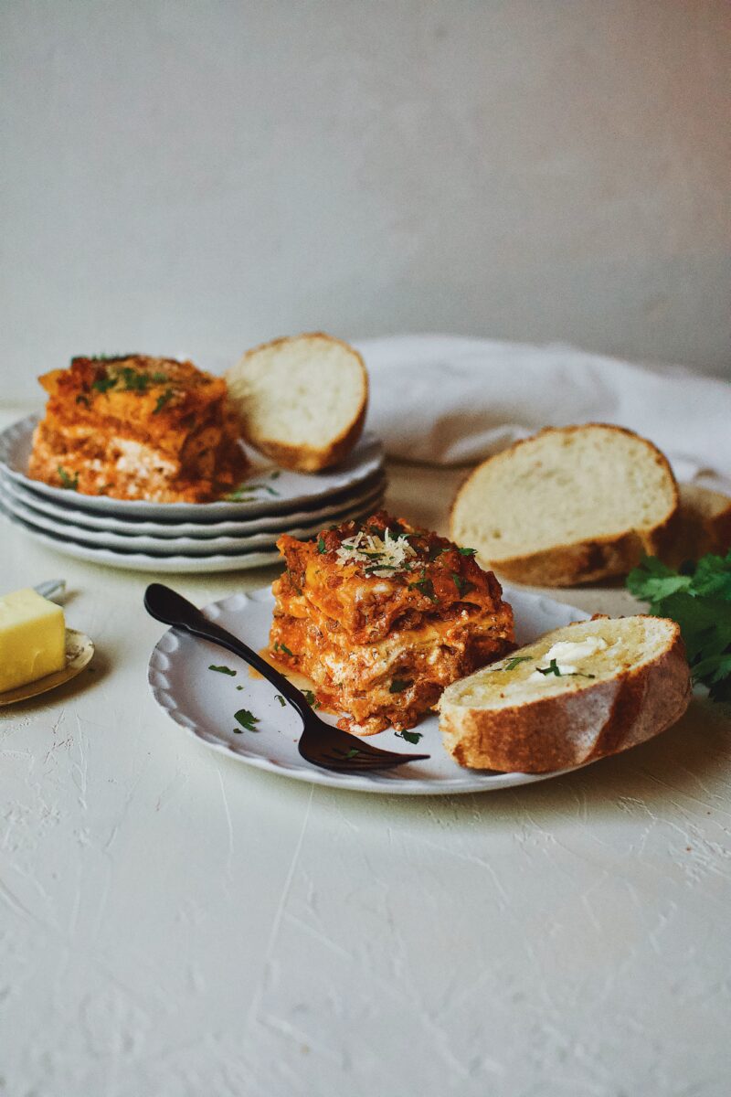 Homemade Lasagna served with toasted bread and butter.