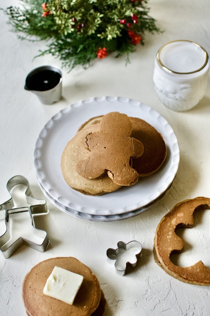 Gingerbread Pancakes stacked up and a gingerbread man cut out of one.