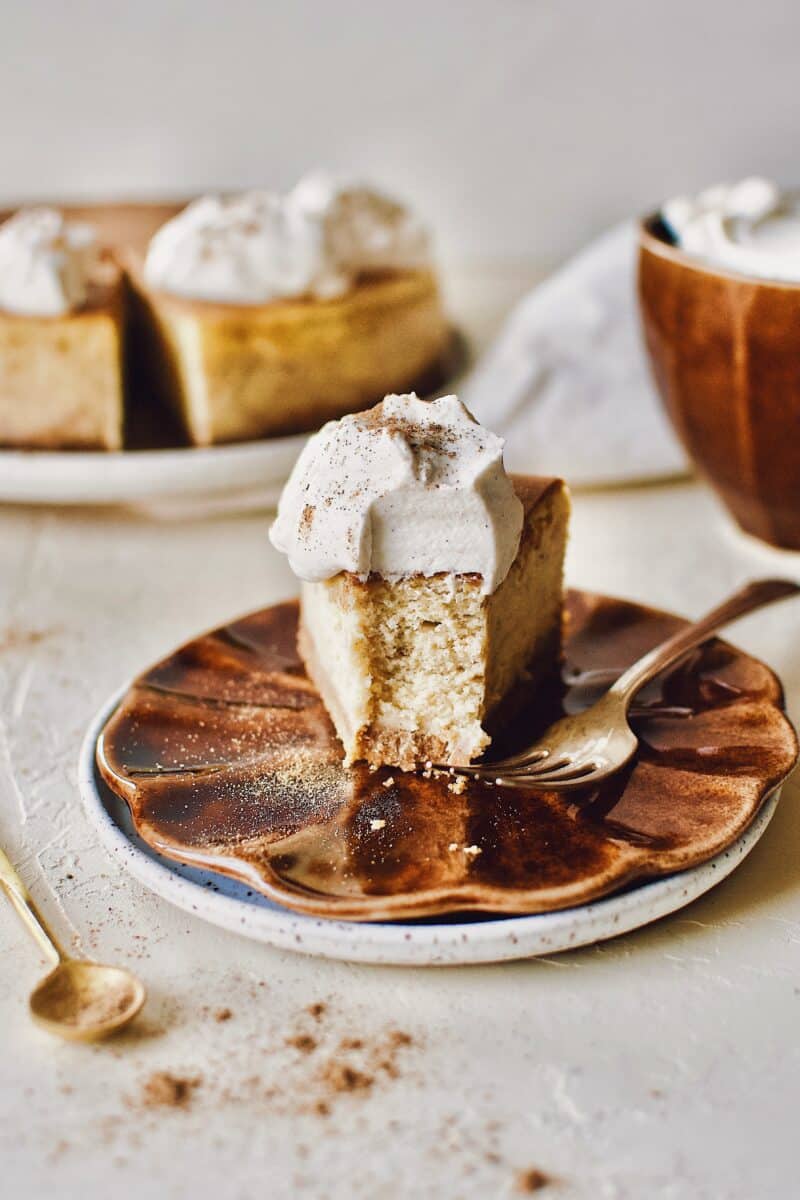 Chai-Spiced Cheesecake with a bite taken out of it.