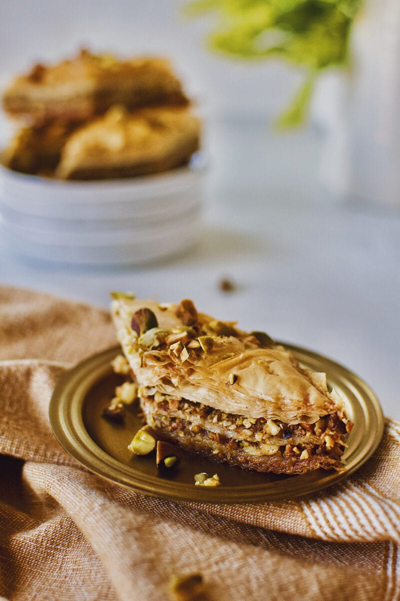 Joanna Gaines recipe for Baklava served right out of the baking dish on a gold plate.