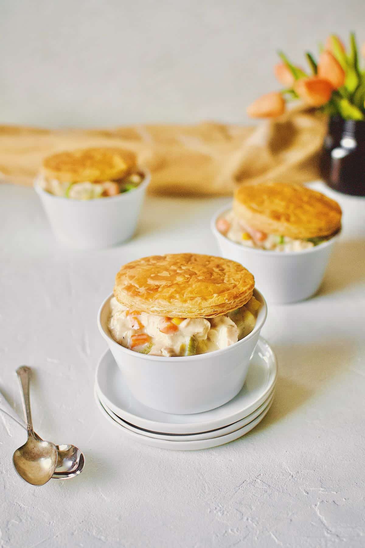 3 individual Chicken Pot Pie with Puff Pastry tops.