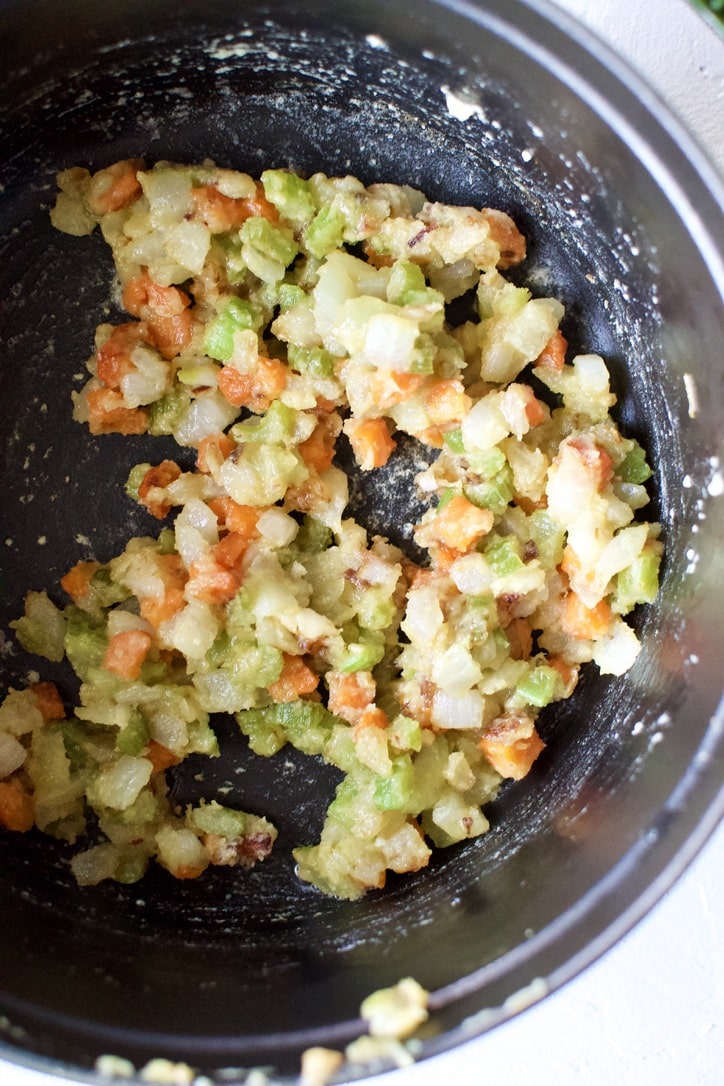 Diced onion, garlic, carrot, and celery sauteed in butter, with flour added to the pot to make a roux.