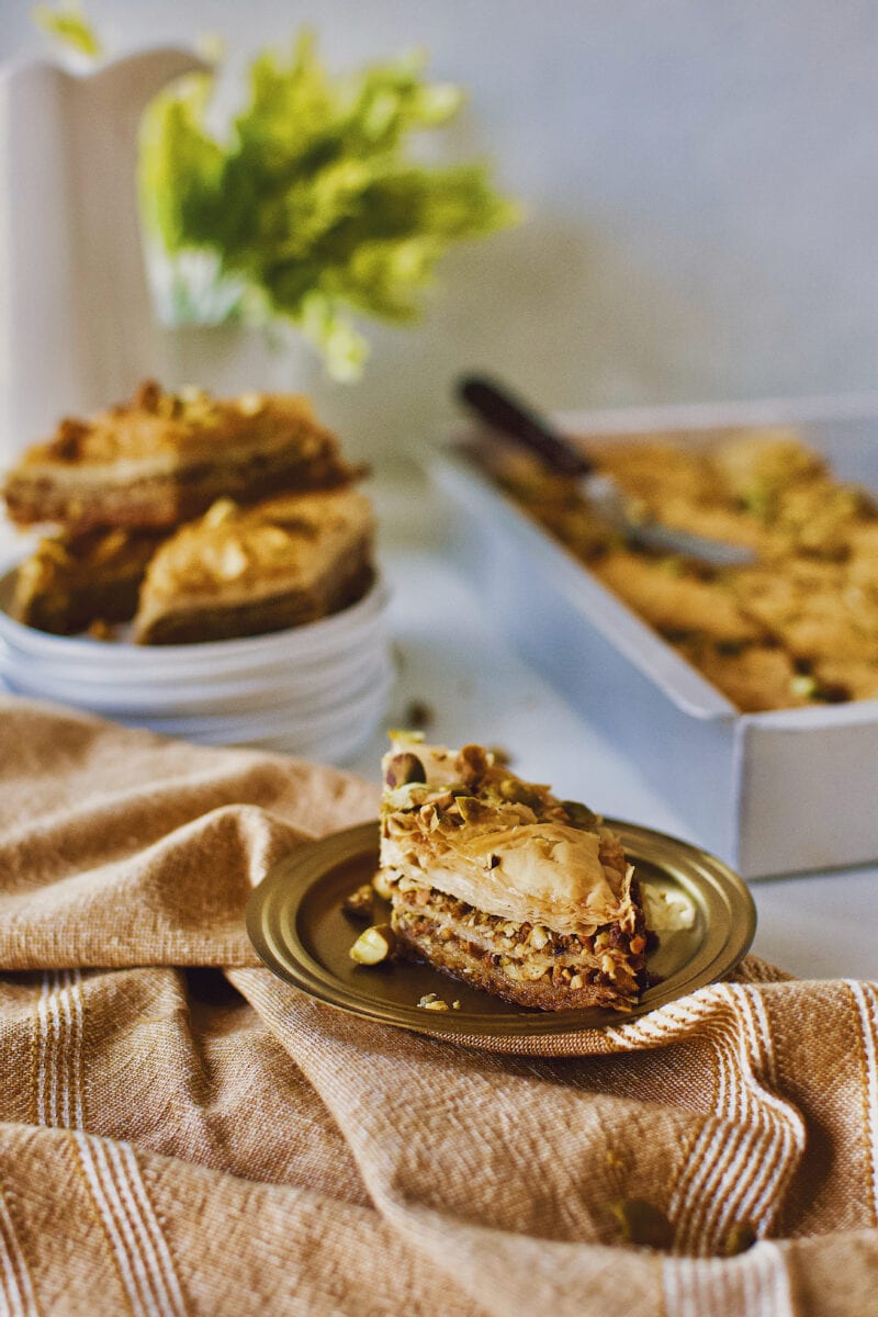 Joanna Gaines recipe for Baklava served right out of the baking dish on a gold plate.