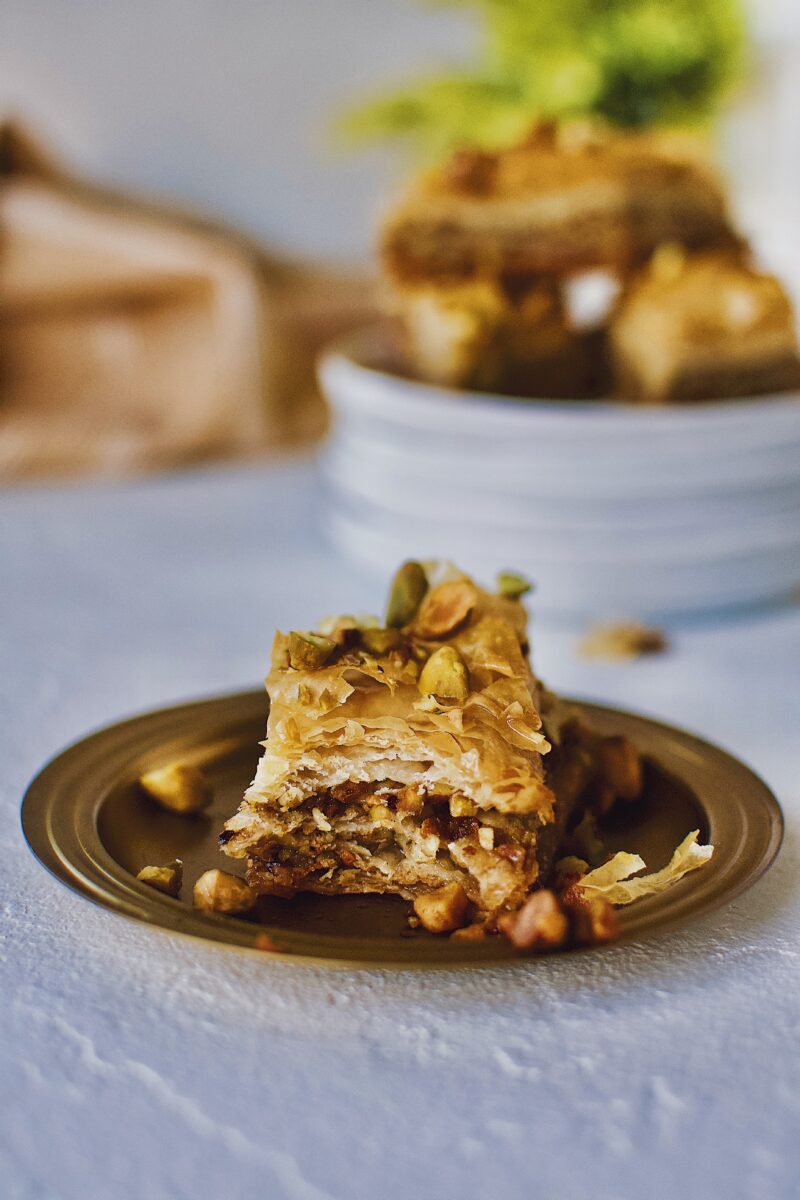 Joanna Gaines recipe for Baklava served right out of the baking dish on a gold plate.