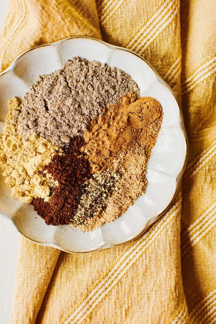 Chai Spice Mix spices portioned out on a plate.