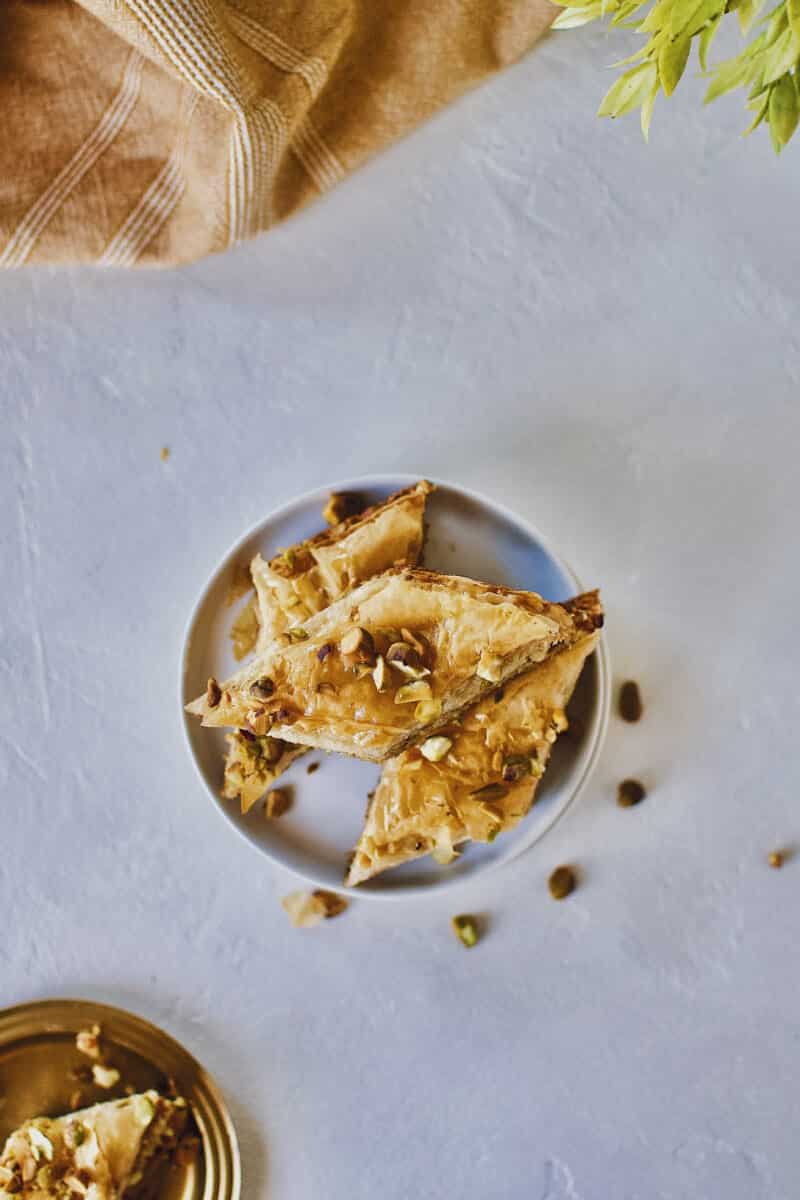 Joanna Gaines recipe for Baklava stacked on a white plate.