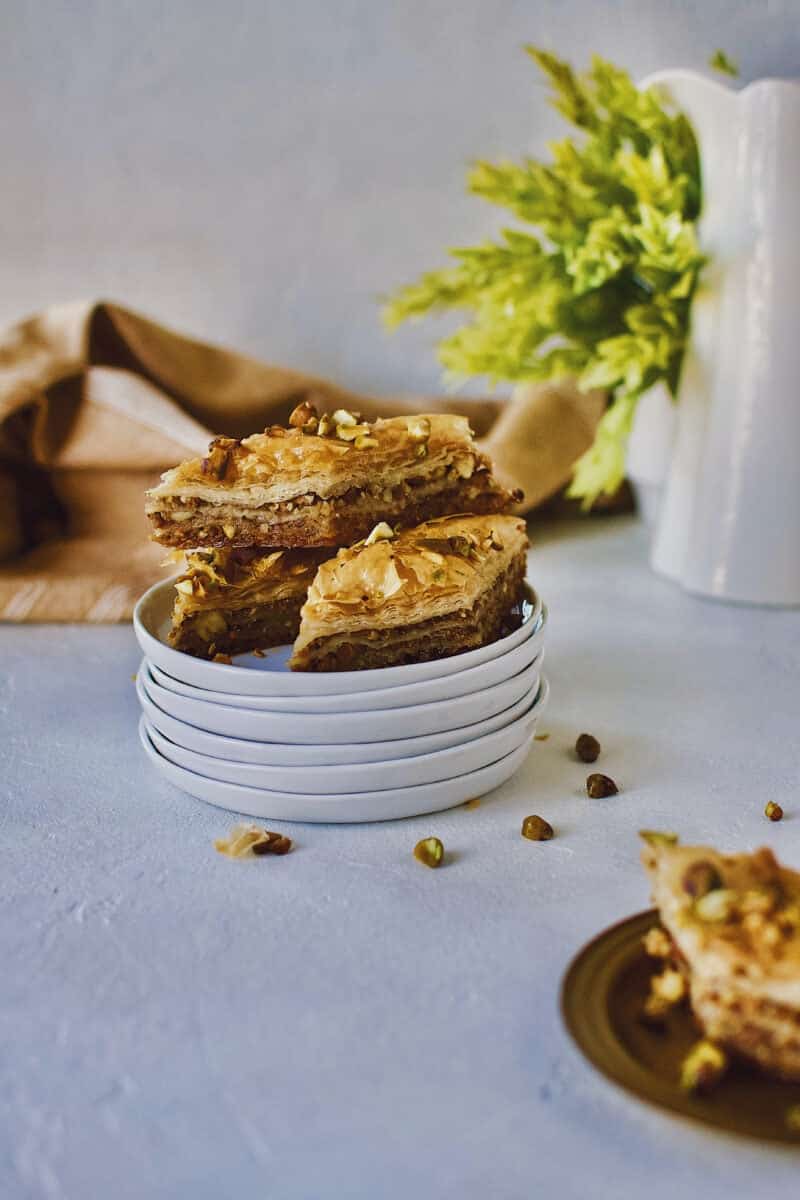 Joanna Gaines recipe for Baklava stacked on a white plate.