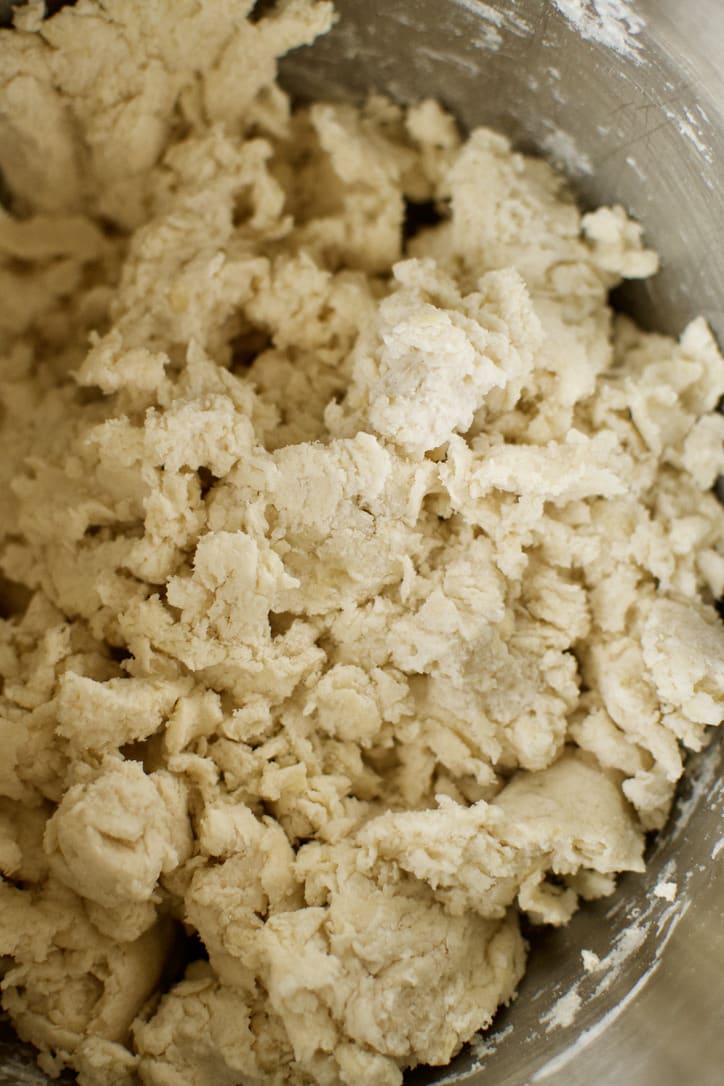 Scone dough coming together in the bowl of a stand mixer