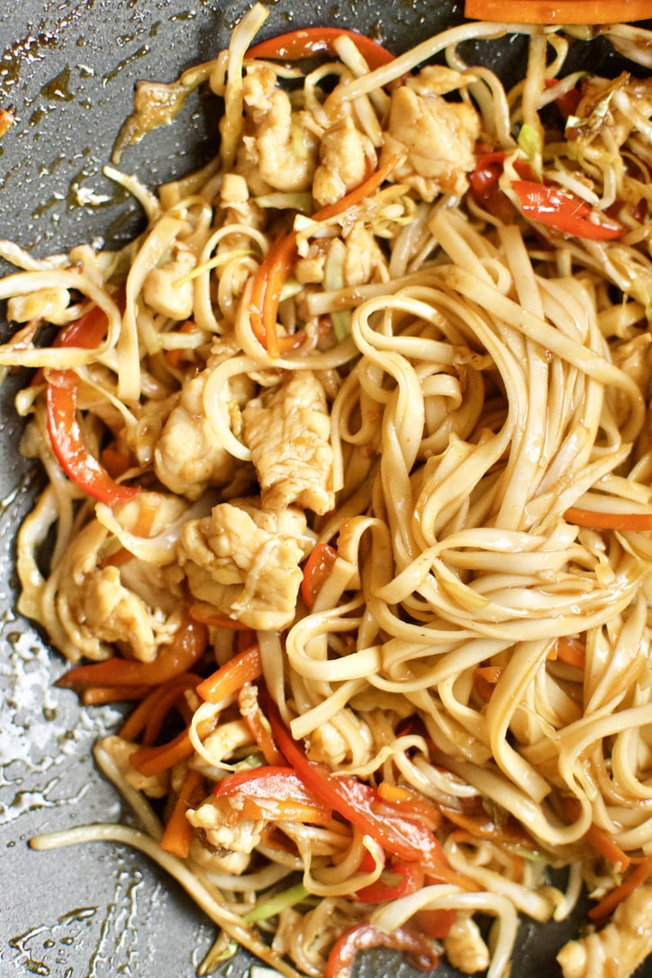 Noodles added to the chicken, veggies, and sauce to complete the dish of Chicken Lo Mein.