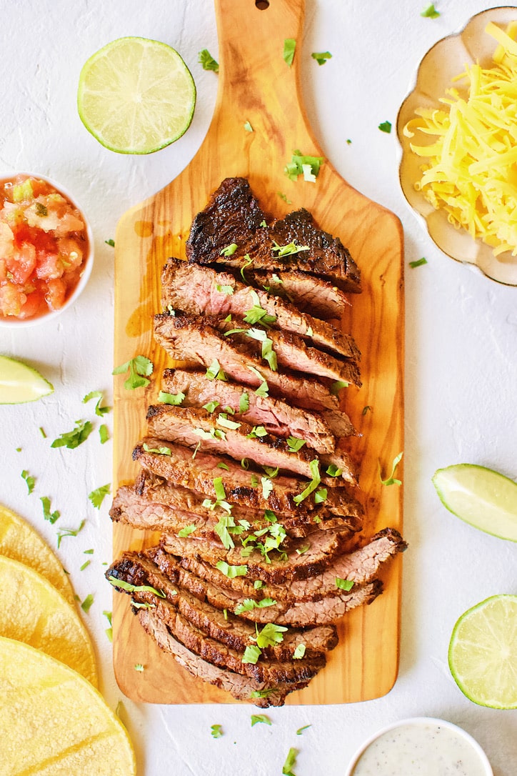 Carne Asada Fajita Steak on a chopping board.