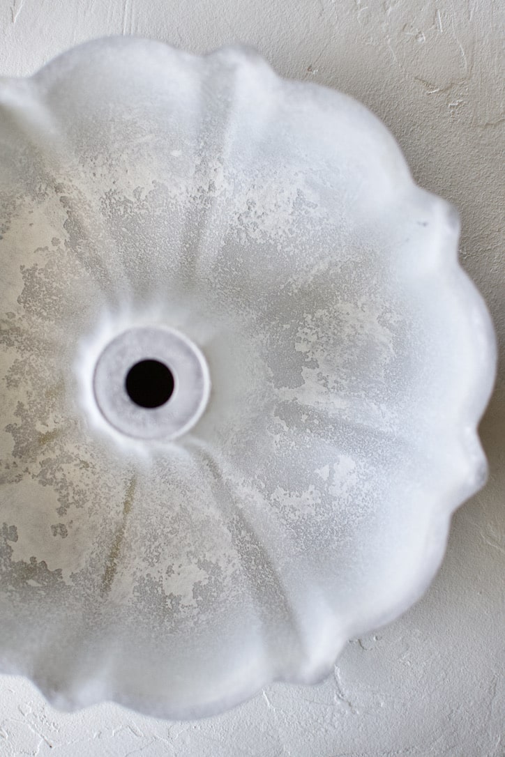 A buttered and floured bundt cake pan.