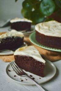 Sliced Guinness Stout Cake, on various plates, ready to be served.