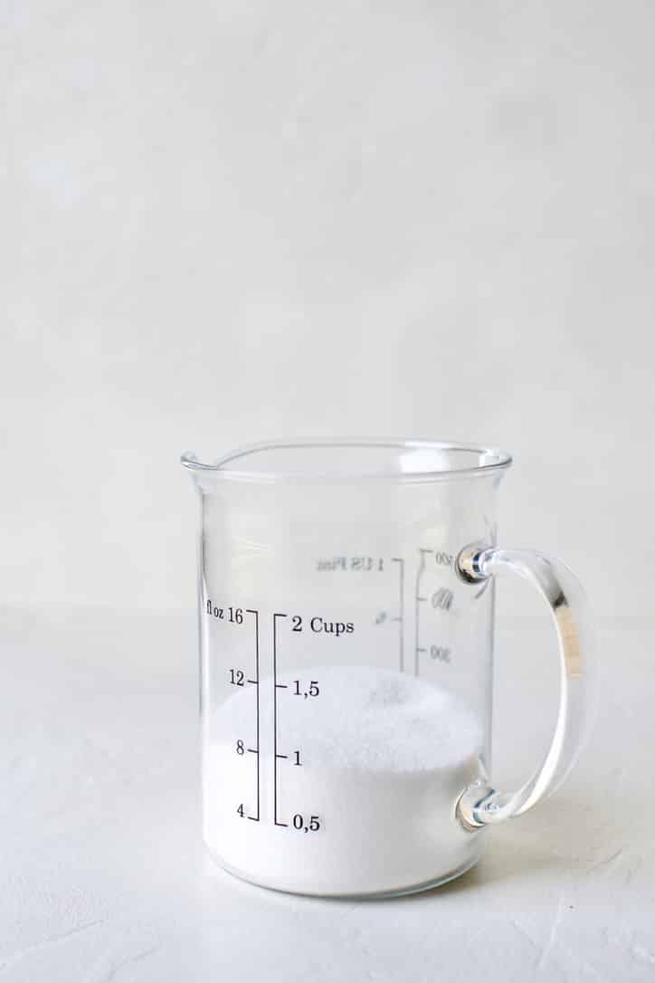 1 cup of sugar in a 2 cup measuring cup. Ready to make simple syrup in.